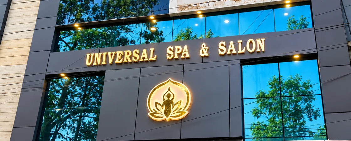 Building front with the gold Universal Spa & Salon sign and lotus emblem
